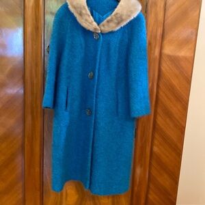 Vintage blue wool coat with mink collar and large sea shell buttons .